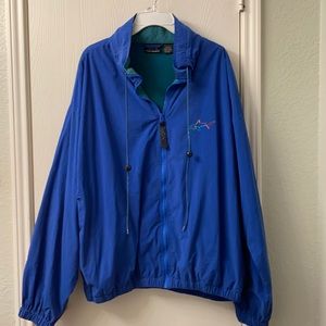 Greg Norman (The Shark)  Men’s Wind Jacket size XL.  Royal Blue